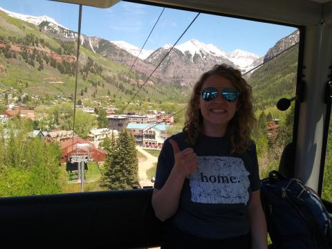 Taking a ride on the gondola up the mountain. 